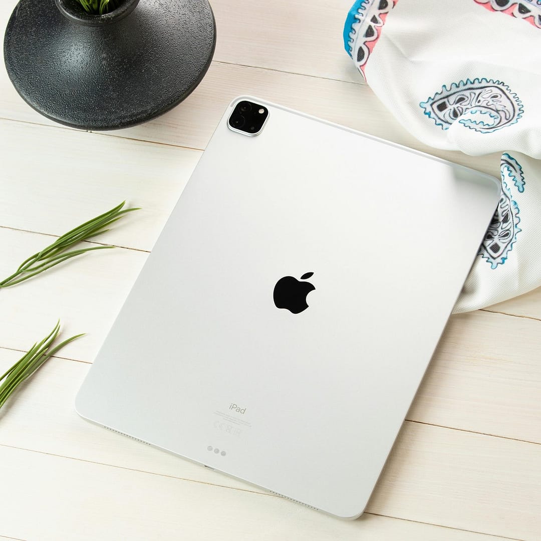 A contemporary tablet displayed on a styled flat lay, showcasing modern technology aesthetics.